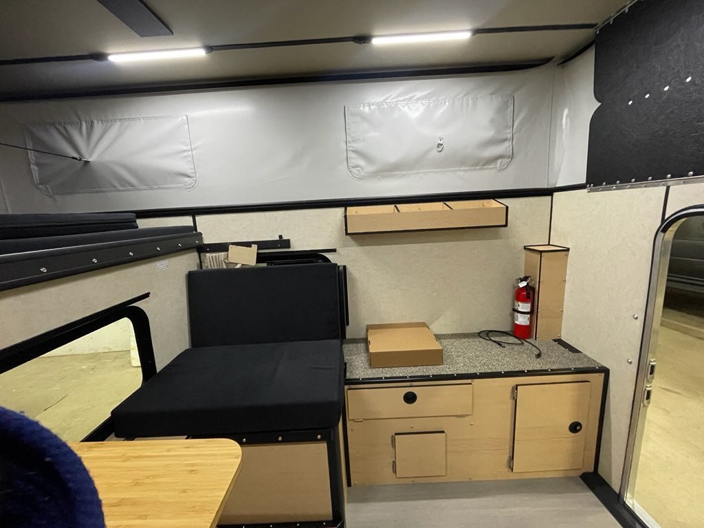 An In-Stock Showroom Inventory: 2025 HAWK Four Wheel Camper Base Model with Front Dinette Floor Plan